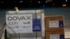 KOSOVO -- Airport personal unload the first batch of the AstraZeneca vaccines sent from the Covax facility, at Adem Jashari airport Pristina, March 28, 2021