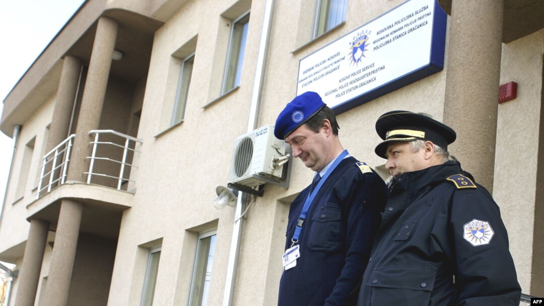 A Hungarian EULEX police officer (left) walks with his local counterpart in the Serbian enclave of Gracanica.