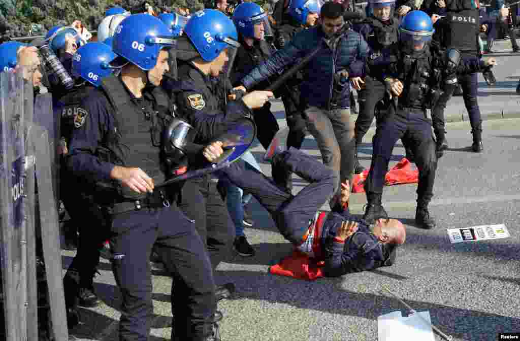 Riot police clash with demonstrators who gathered to commemorate last year&#39;s deadly suicide bombing near the main train station in Ankara, Turkey, on October 10. (Reuters/Umit Bektas)