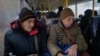 Ukrainians in Pavlohrad in the Donetsk region are evacuated to western Ukraine as they flee a Russian offensive. 