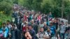 A magyar állam által Röszkétől vonattal hozott bevándorolni szándékozókat tereltek Hegyeshalom egyik utcájába, hogy gyalog menjenek az osztrák határig 2015. szeptember 14-én