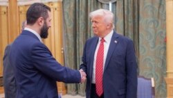 US President Donald Trump (right) shakes hands with Syria's interim President Ahmad al-Sharaa in Riyadh on May 14. 