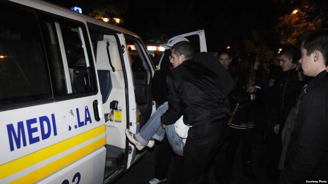 Injured concertgoers are transported for medical attention after the October 14 explosion in Chisinau.