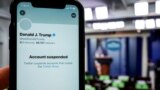 A photo illustration shows the suspended Twitter account of U.S. President Donald Trump on a smartphone.