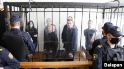 The 2021 trial of Belarusian opposition politicial Paval Sevyarynets (center) and others. The Vyasna human rights center has recognized a total of 1,451 political prisoners in Belarus.