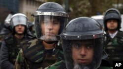 Iranian Basij paramilitary forces attend a rally marking the 35th anniversary of establishment of the force, at Felestin (Palestine) square in Tehran, Iran, Wednesday, Nov. 26, 2014