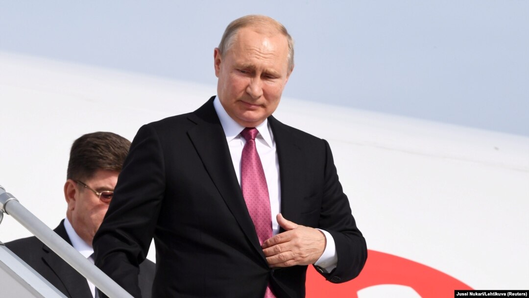 Russian President Vladimir Putin arrives at Helsinki's airport on August 21.