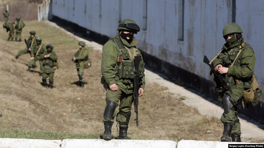 Russian soldiers in front of a Ukrainian military base in Crimea in March 2014