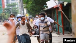 Полициямен қақтығыста оққа ұшқан наразы. Янгон, Мьянма, 14 наурыз 2021 жыл.