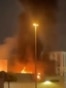 Dubai - smoke rising near the US Consulate after a drone struck a nearby parking lot - screen grab AFP UGC