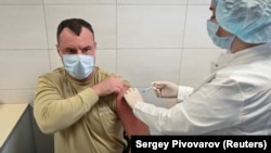 A Russian Army soldier receives an injection of the Sputnik-V vaccine against COVID-19 at a clinic in the city of Rostov-On-Don. Russia has placed its hopes in the domestically produced vaccine instead of lockdown measures.