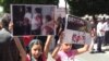 Armenia -- Armenian Yazidi children hold posters during a protest action in front of the Prime Minister's Office, Yerevan, 14 August 2014 