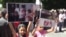 Armenia -- Armenian Yazidi children hold posters during a protest action in front of the Prime Minister's Office, Yerevan, 14 August 2014 