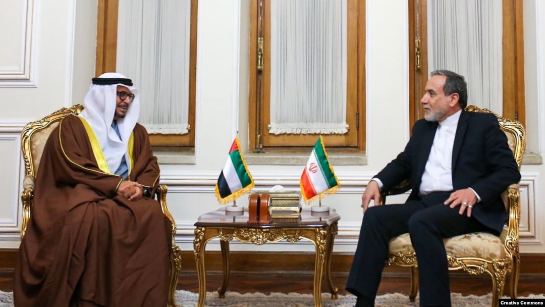 Anwar Gargash (left), a diplomatic adviser to the president of the UAE, meets Iranian Foreign Minister Abbas Araqchi in Tehran on March 12.