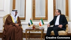 Anwar Gargash, the diplomatic adviser to the president of the UAE, meets Iran's Foreign Minister Abbas Araqchi in Tehran on March 12.
