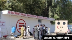 An ambulance transports injured victims to Emergency hospital in Lashkar Gah, capital of the southern Helmand Province, after Taliban launched a large-scale attack on the city earlier in October.