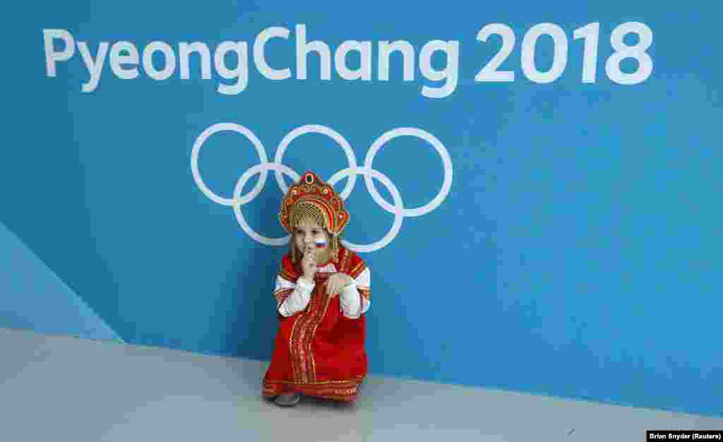 A young fan poses for the camera in the Olympic ice-hockey venue at the Pyeongchang Winter Games. (Reuters/Brian Snyder)