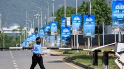A police officer walks on the premises of the Serena Hotel on April 21 as Pakistan prepares to host the United States and Iran for the second round of peace talks in Islamabad.
