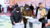 Election workers count ballots at a polling station in the village of Gornaya Mayevka outside Bishkek following Kyrgyzstan's parliamentary elections on November 28.