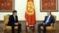 Kyrgyz President-elect Sooronbai Jeenbekov (left) sits with outgoing President Almazbek Atambaev.