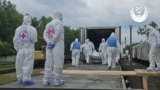 UKRAINE -- Picture shows bodies of deceased Ukrainians being returned to Ukraine on June 13. 