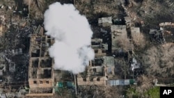 Smoke billows after Russian attacks on the outskirts of Bakhmut on December 27.