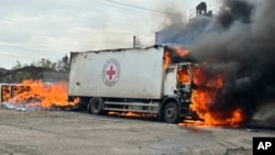 Red Cross employees had been bringing fuel briquettes to residents of the war-torn Donetsk region when the attack occurred. 