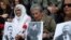 Turkey -- Turks hold up pictures of Armenian intellectuals rounded up and executed in 1915 during a public commemoration in Istanbul, 24Apr2010