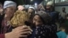 Family members greet new arrivals at the train station in Zhanaozen in Kazakhstan’s Manghystau region on May 13.