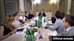 Ukrainian President Petro Poroshenko meets with Pavel Sheremet's family in Kyiv on July 11.