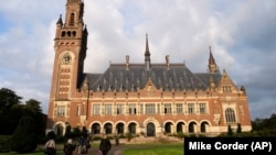 NETHERLANDS -- People walk toward the International Court of Justice in the Hague, August 27, 2018