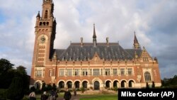 NETHERLANDS -- People walk toward the International Court of Justice in the Hague, August 27, 2018