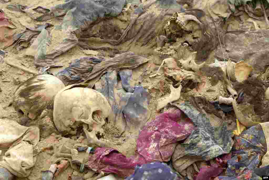 Remains recovered from a mass grave in the Al-Samawa desert, 270 kilometers south of Baghdad, April 2005. Evidence from this discovery and others like it formed the basis of Saddam Hussein&#39;s second trial.