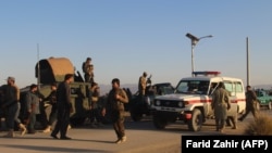 Afghan soldiers near the mosque where a suicide bomber blew himself up in the southeastern province of Khost.