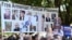 Armenia - Protesters hold pictures of jailed opposition figures during EU Commission President Ursula von der Leyen's talks with Prime Minister Nikol Pashinian, Yerevan, July 2, 2026.