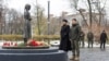 Ukrainian President Volodymyr Zelenskiy and first lady Olena Zelenska visit a monument to Holodomor victims in Kyiv on November 23. 