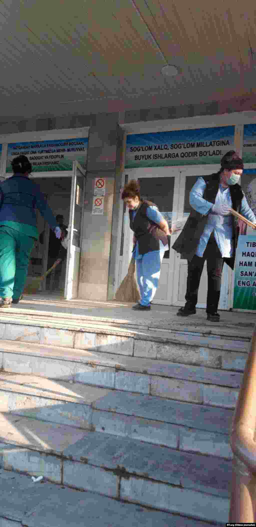 Workers outside a hospital in Tashkent, Uzbekistan