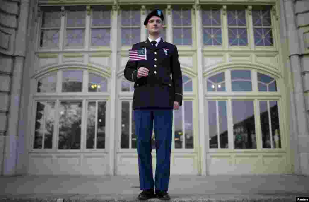 Vasily Sergeyevich Sirotin, originally from Russia and an active U.S. Army Reserve officer, poses for a photograph after becoming a U.S. citizen in a naturalization ceremony on the steps to the Ellis Island National Museum of Immigration at Ellis Island, New York. (Reuters/Mike Segar)