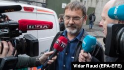 Russian Mikhail Bochkaryov talks to the media after he was released from custody in Oslo on October 19.