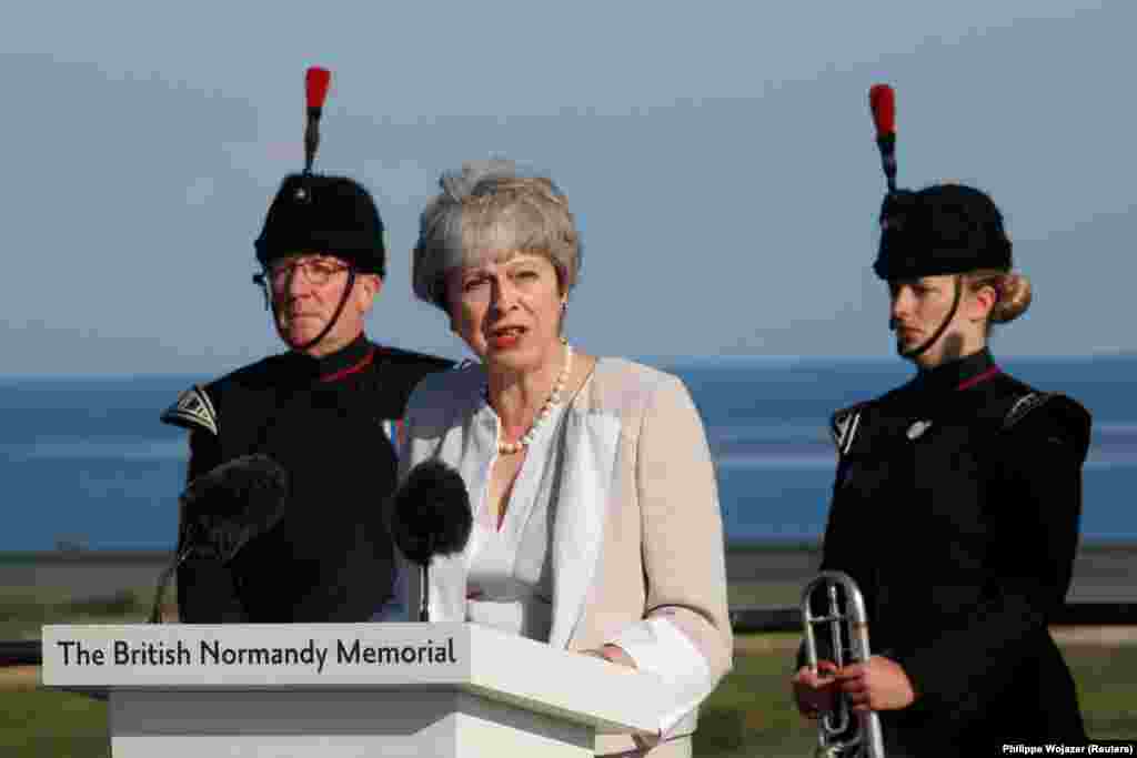 FRANCE -- British Prime Minister Theresa May delivers a speech during a Franco-British ceremony for the laying of the first stone of a British memorial in Ver-Sur-Mer as part of ceremonies to mark the 75th anniversary of D-Day landings in Normandy, June 6, 2019. May said, "If one day can be said to have determined the fate of generations to come, in France, in Britain, in Europe and the world, that day was the 6th of June, 1944." To the veterans, she said "the only words we can -- thank you."