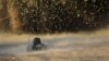 A U.S. Army Explosive Ordnance Disposal robot is seen during an explosion of an improvised explosive device in Arghandab valley, northwest of Kandahar, in Afghanistan.