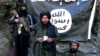 Former Islamic State-Khorasan leader Hafez Saeed (center) speaks in a video at an undisclosed location on the Pakistani-Afghan border.