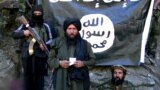 Former Islamic State-Khorasan leader Hafez Saeed (center) speaks in a video at an undisclosed location on the Pakistani-Afghan border.