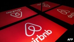 the logo of the online lodging service Airbnb displayed on a tablet in Paris