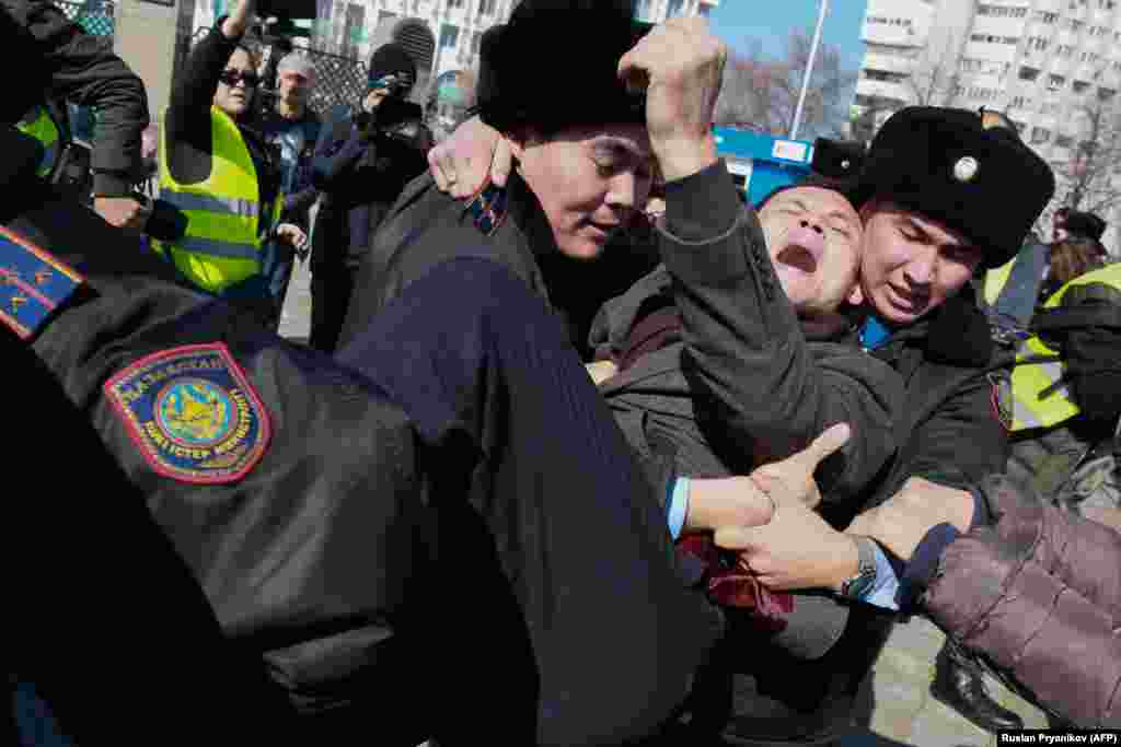 Police in Kazakhstan detained more than 60 people in Almaty&nbsp; on March 1 after an activist&#39;s death in jail triggered diplomatic condemnation and calls for anti-government rallies. The protests were called after Dulat Agadil, a prominent activist, died in detention hours after he was detained by plainclothes police. (AFP/Ruslan Pryanikov)