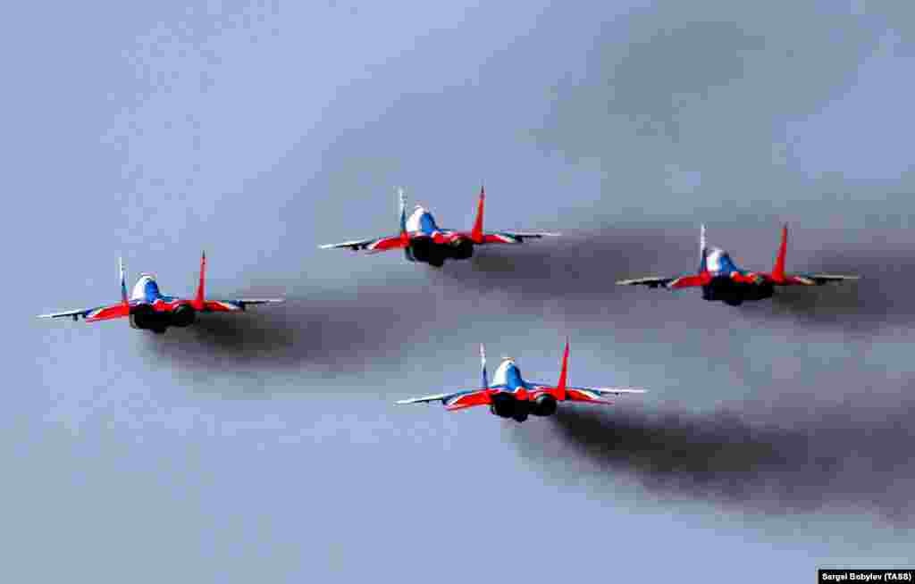 Russian fighter jets fly in formation during a rehearsal for a military parade marking the 75th anniversary of the victory over Nazi Germany in World War II, in Alabino on June 10. (TASS/Sergei Bobylev)