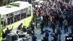 People react as Turkish police officers block the streets near the site of a strong blast in the southeastern city of Diyarbakir on November 4 that killed nine people.