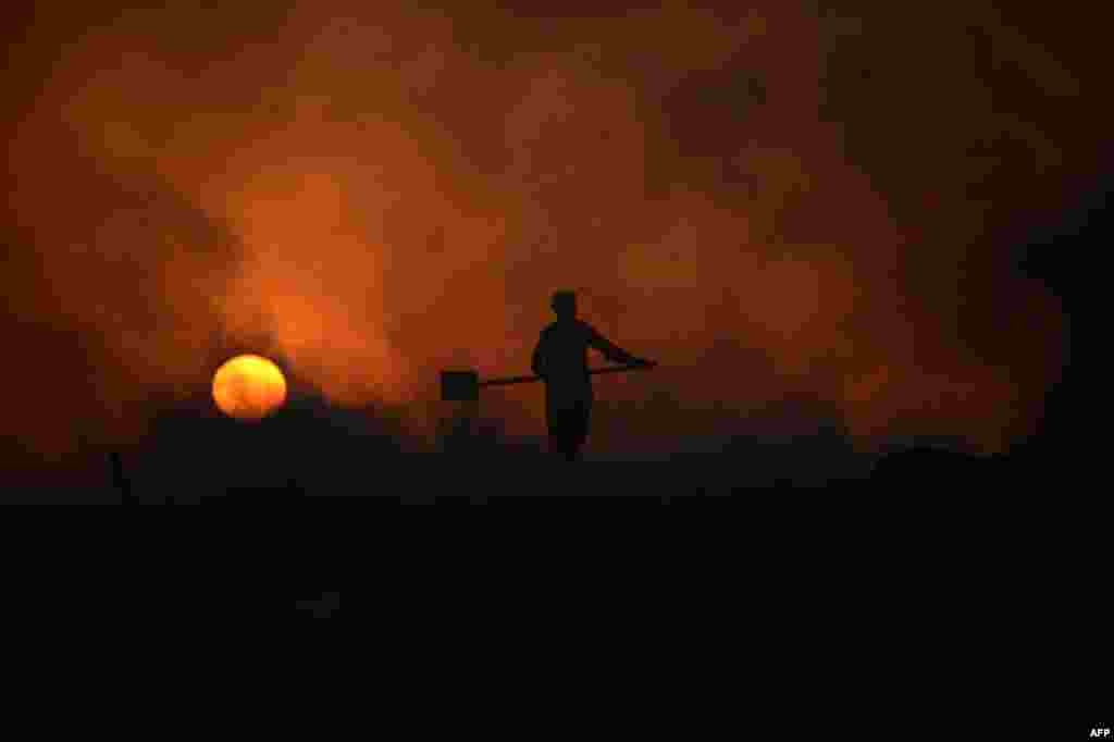 Afghan laborer Sakhidad, 24, works in a chalk factory on the outskirts of Mazar-e Sharif. (AFP/Farshad Usyan)