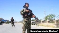 Afghan army soldiers at a check post during the Eid al-Fitr holiday.