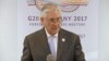 Tillerson Tells Lavrov To Honor Ukraine Commitments video grab